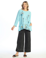 Model styling Confetti Tunic with casual bottoms