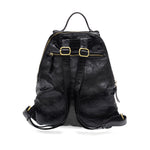 Maggie Modern Backpack in distressed vegan leather with adjustable straps.