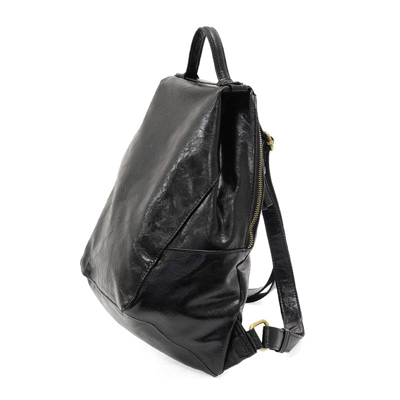Maggie Modern Backpack in distressed vegan leather with adjustable straps.