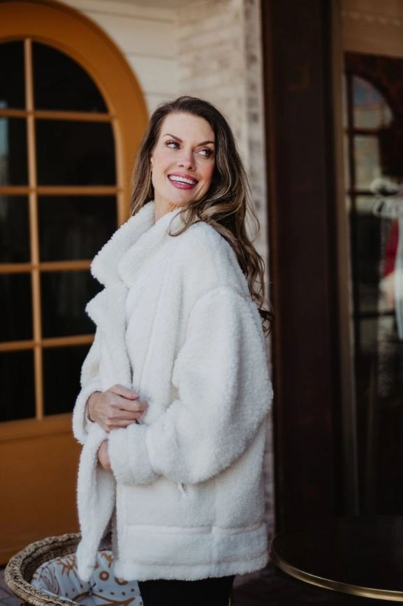 Sherpa teddy jacket styled with jeans and boots