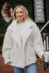 White sherpa teddy jacket with faux leather trim and button closure