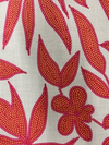 Close-up of tassel tie and v-neckline on cotton mini dress
