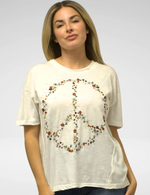 Front view of Chloe Tee with colorful floral peace sign graphic