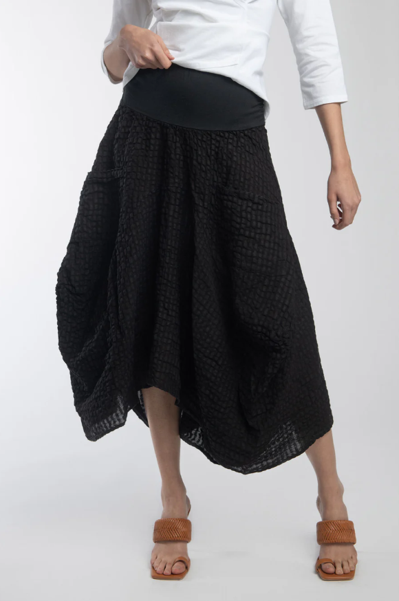 Paloma Skirt front view showing midi length and seaming