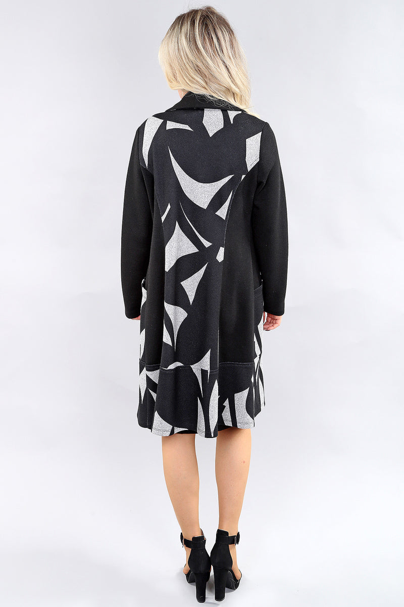 Long black abstract print coat with button front and pockets by Michael Tyler.