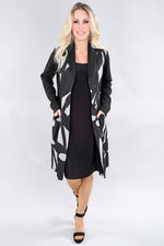 Long black abstract print coat with button front and pockets by Michael Tyler.