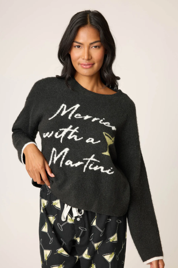 Women’s black snuggle knit sweater with “Merrier with a Martini” graphic.