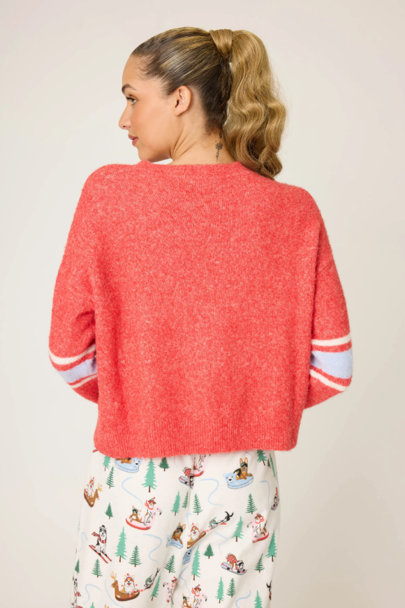Cozy women’s holiday pullover in red with cheeky graphic and fuzzy texture.