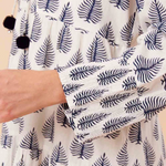 Shell button detail on full-length sleeve – feminine and breezy summer style