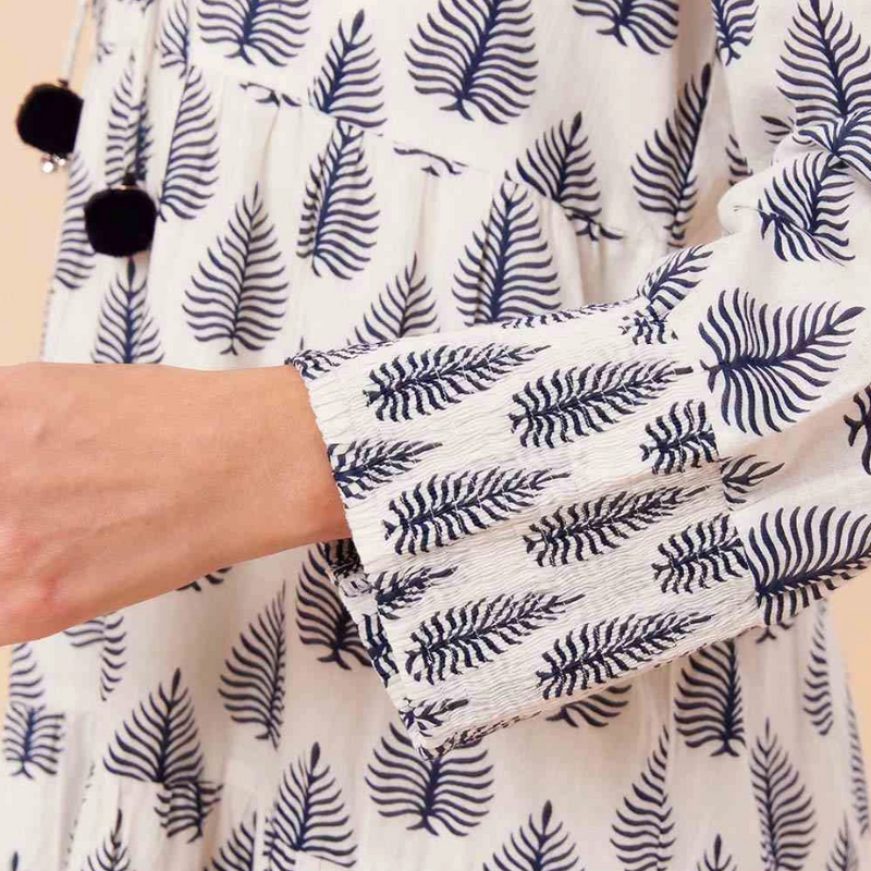 Shell button detail on full-length sleeve – feminine and breezy summer style