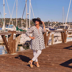 Boho-inspired navy cotton dress with full-length sleeves and tiered silhouette