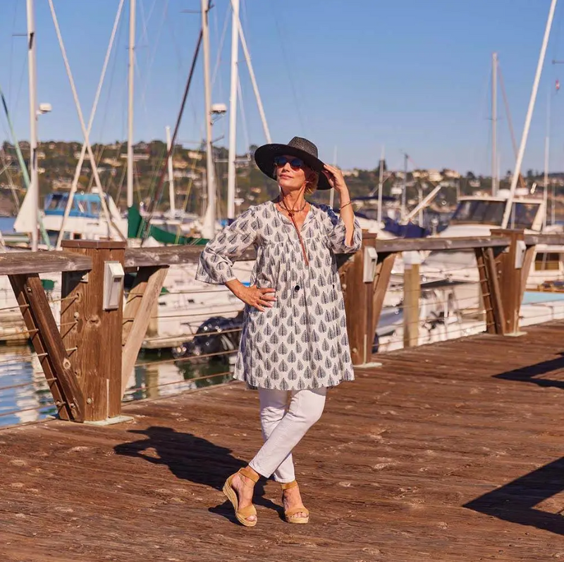 Boho-inspired navy cotton dress with full-length sleeves and tiered silhouette