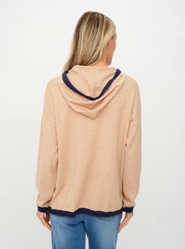 Back view of cozy lounge hoodie in soft neutral tones