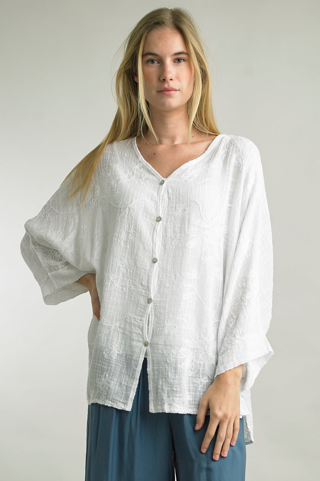 Model wearing Tempo Paris embroidered button-up cotton blouse in White