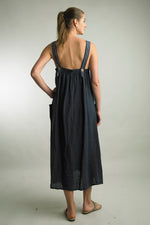 Midi length relaxed linen dress with wide straps, ideal for beach and boardwalk
