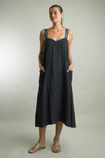 Lightweight linen dress with side pockets, perfect for summer days