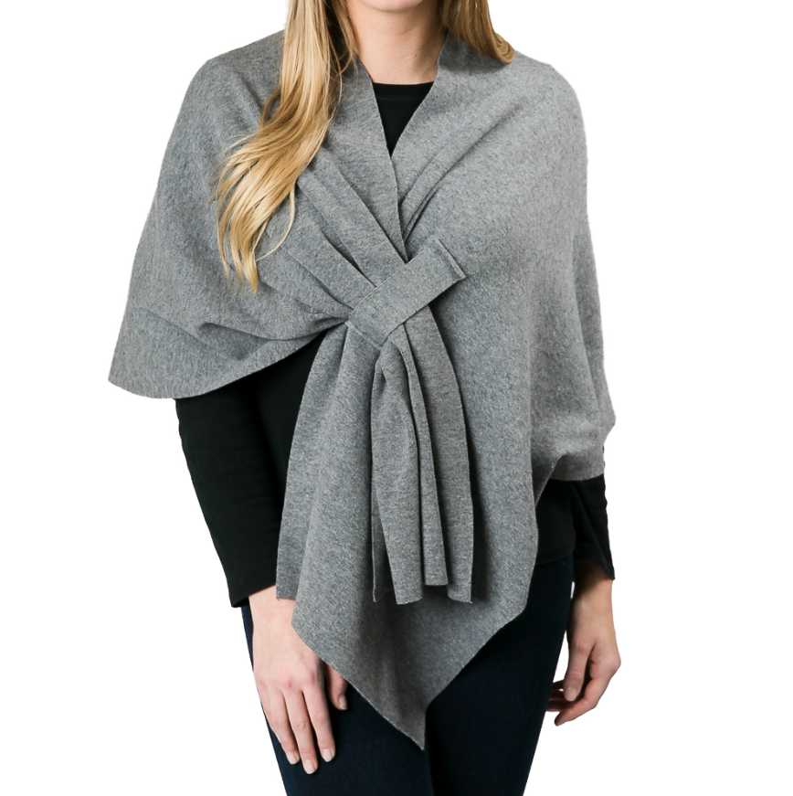Soft knit wrap in solid color styled for layering.