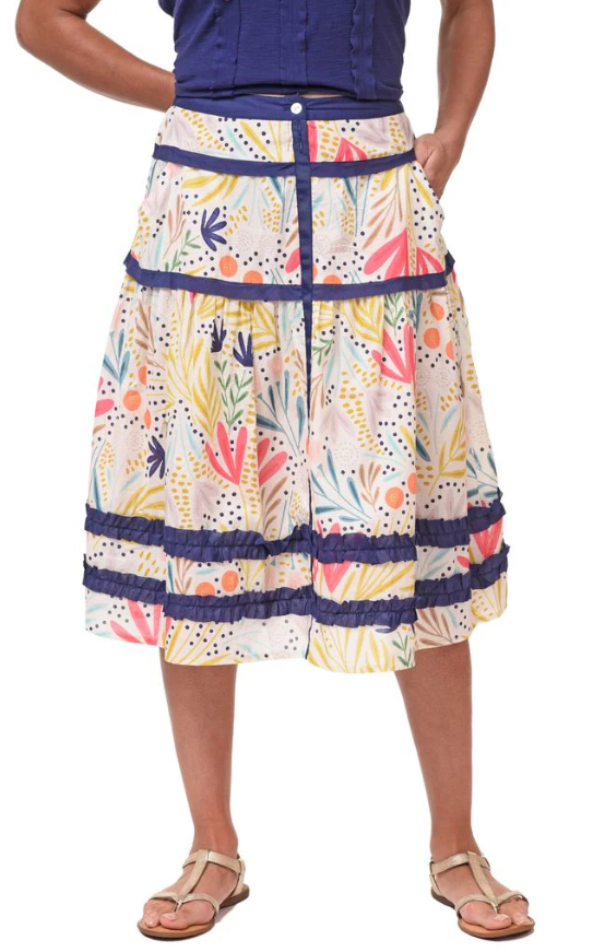 Model wearing Tulip floral skirt styled with a summer top and sandals