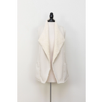 Soft sherpa vest with open front and exposed seams, made in the USA