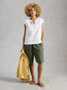 Organic cotton embroidered summer top with notch neckline in the color white at The Lazy Daisy