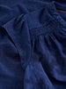 Women’s summer top with notch neck and embroidered detail in the color Indigo Blue at The Lazy Daisy