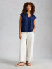 Organic cotton embroidered summer top with notch neckline in the color indigo blue at the Lazy Daisy