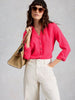 Woman wearing Annie double cloth top by White Stuff in the color Bright Pink at The Lazy Daisy