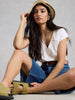 Short sleeve embroidered cotton top with feminine design in the color white at The Lazy Daisy