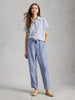 linen trousers relaxed fit summer travel outfit women at The Lazy Daisy