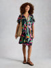 Woman wearing Mini Cleo kimono cover up by White Stuff at The Lazy Daisy