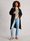 Relaxed fit striped sweater styled for casual fall layering