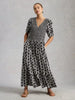 Woman wearing Nola shirred jersey midi dress by White Stuff at The Lazy Daisy