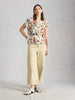 Woman wearing Susie linen tee by White Stuff at The Lazy Daisy