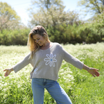Side view of Wooden Ships Meadow sweater showing ribbed hem and side slit
