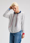 Front view of knit hoodie with kangaroo pouch and contrast cuffs