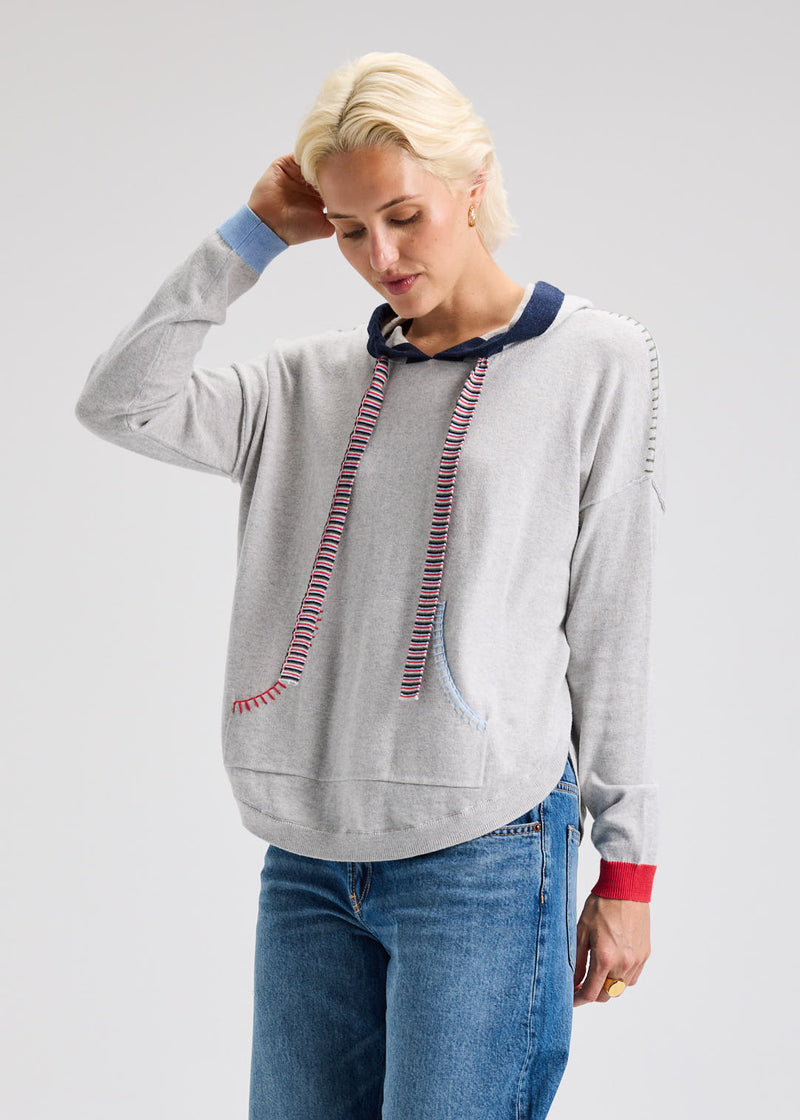 Front view of knit hoodie with kangaroo pouch and contrast cuffs