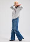 Side view of relaxed-fit hoodie with rounded hem