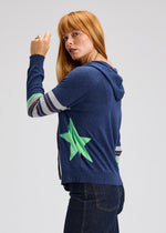 Side view of hoodie showing striped sleeves and relaxed fit