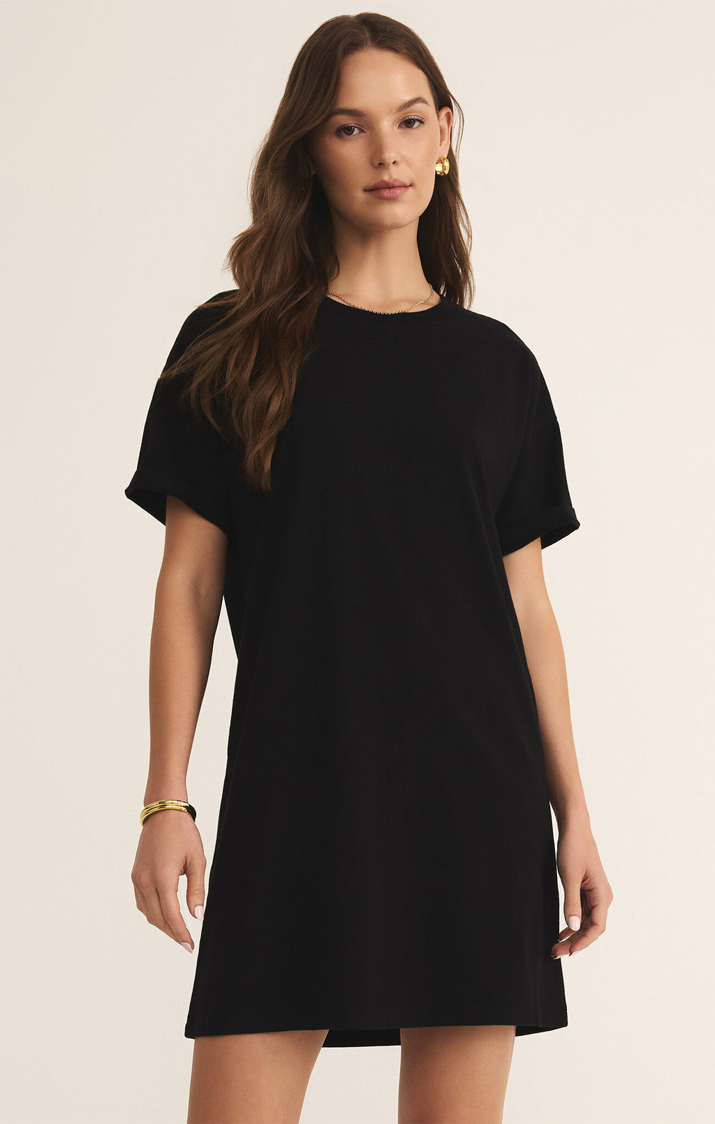 Model wearing the Sway Mini Dress with short sleeves and crew neckline