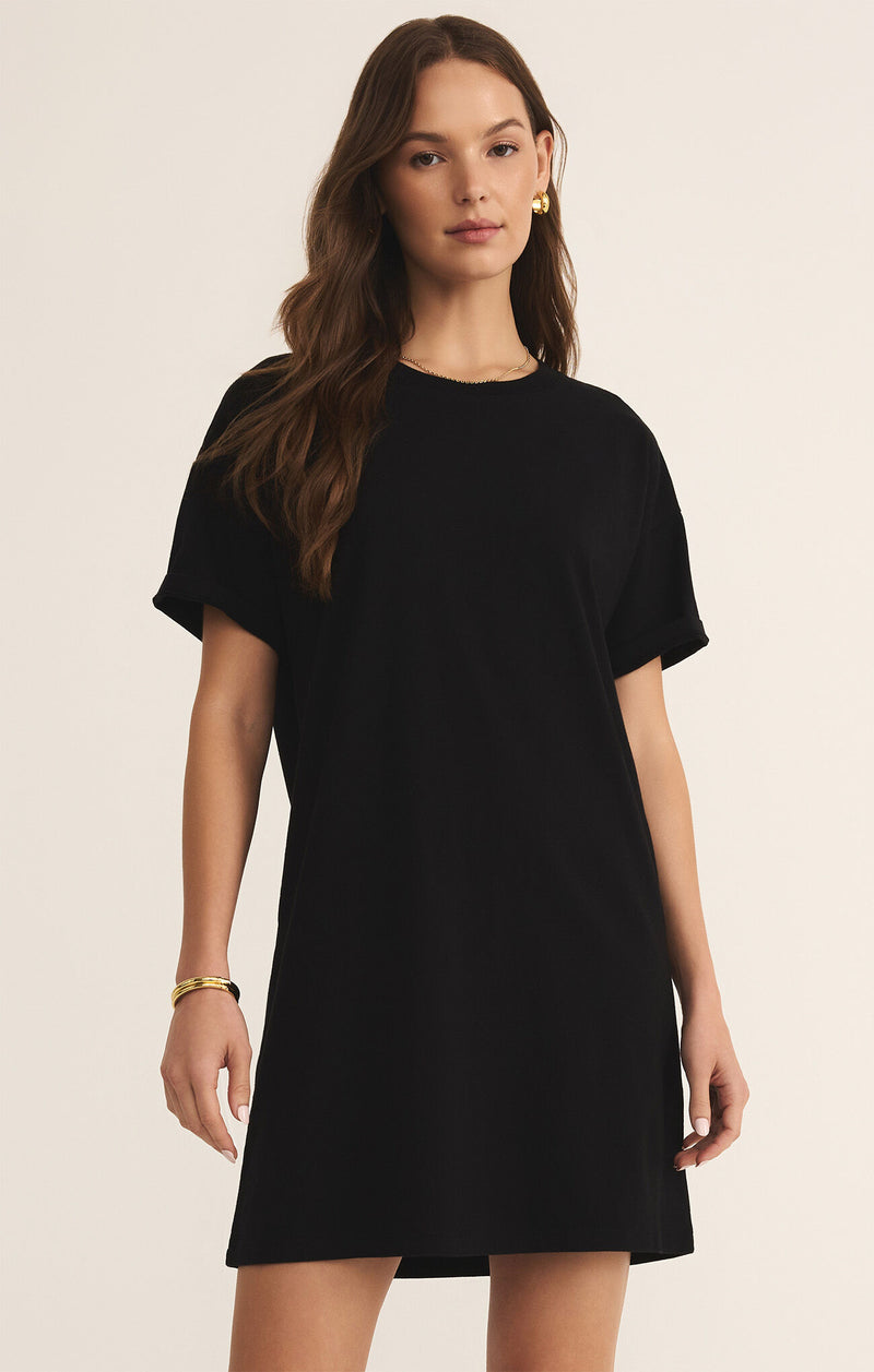 Model wearing the Sway Mini Dress with short sleeves and crew neckline