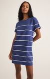 Model wearing the Sway Stripe Mini Dress with coastal stripes and crew neckline