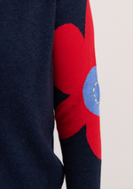Sleeve close-up with flower and peace sign embroidery
