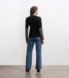 Cozy knit sweater with striped-to-solid sleeve transition and embroidery