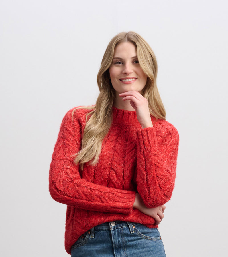 Festive red cable knit sweater with mock neckline and relaxed fit