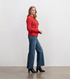 Model wearing Dylan Cable Knit Sweater with blue jeans