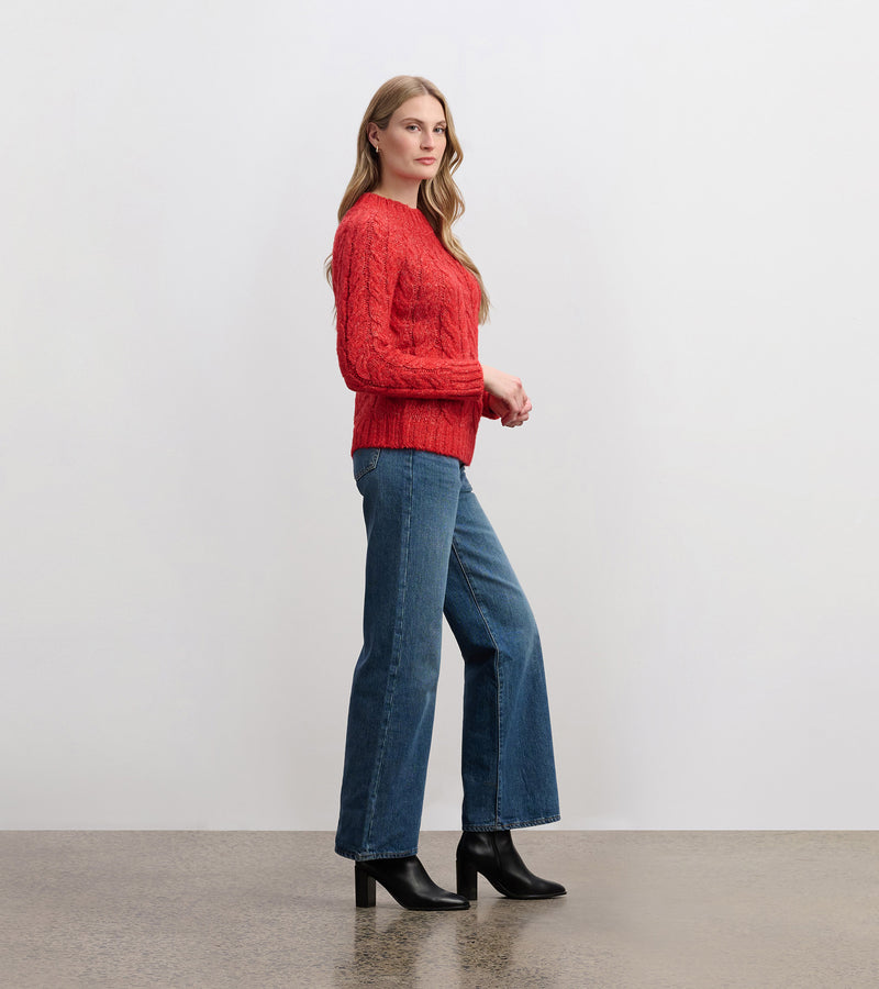 Model wearing Dylan Cable Knit Sweater with blue jeans